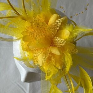 Sunny Yellow Feather Hat with Flower Design